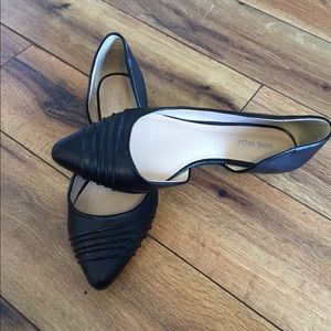 Nine West black flats with an open side